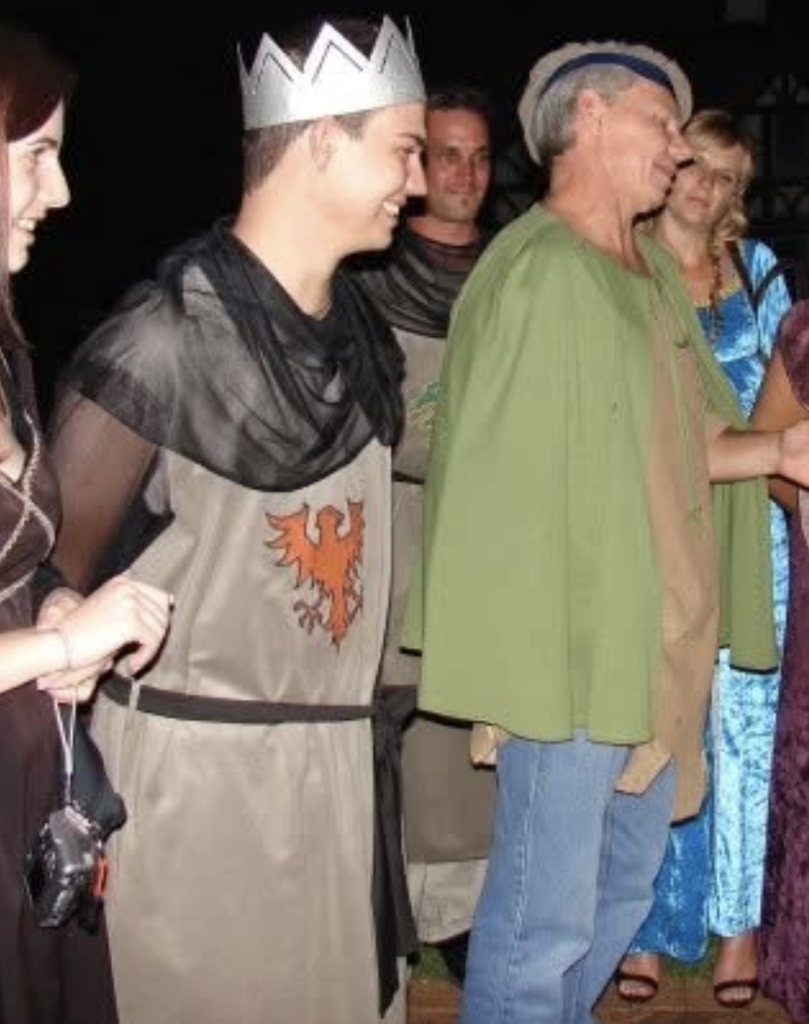 Dad dressed in costume with people at a themed event