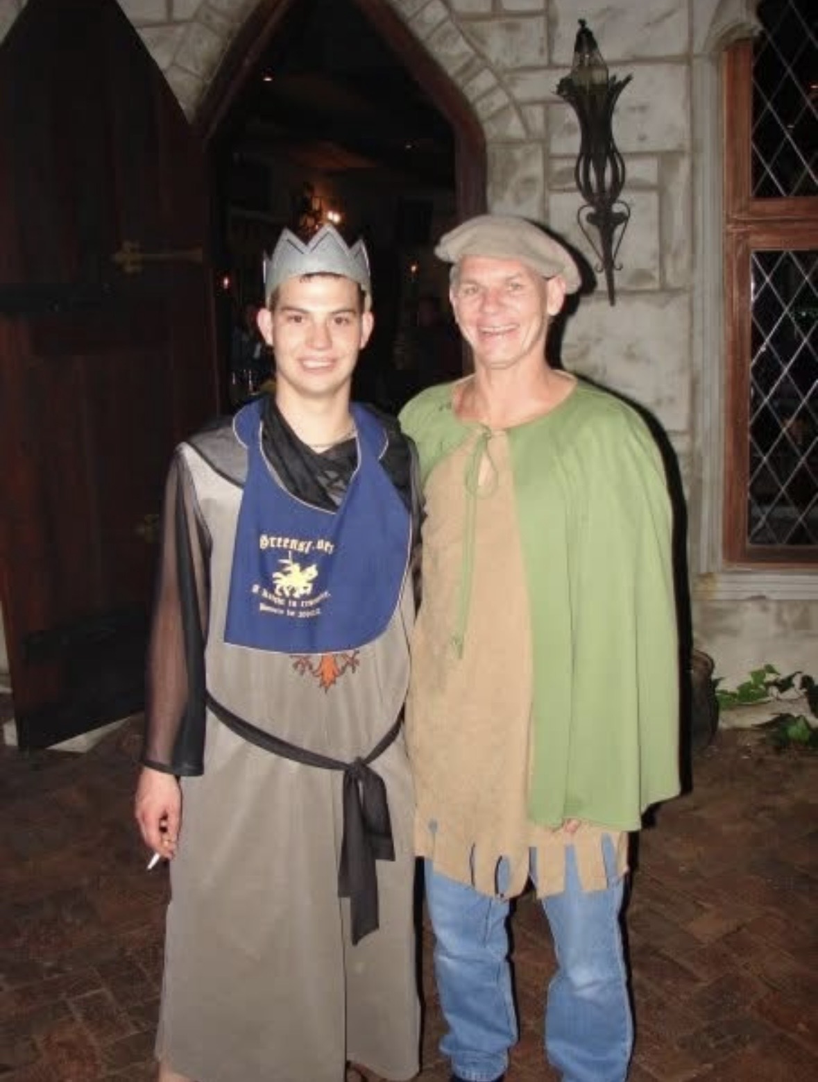 Dad in costume standing with a younger man in costume